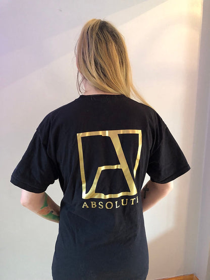 Black T Shirt bearing a transfer style Gold Logo