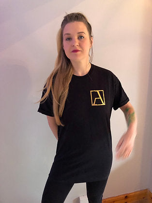 Black T Shirt bearing a transfer style Gold Logo